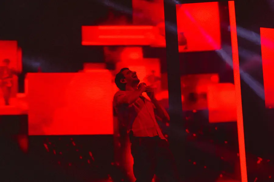 performer under saturated red stage light